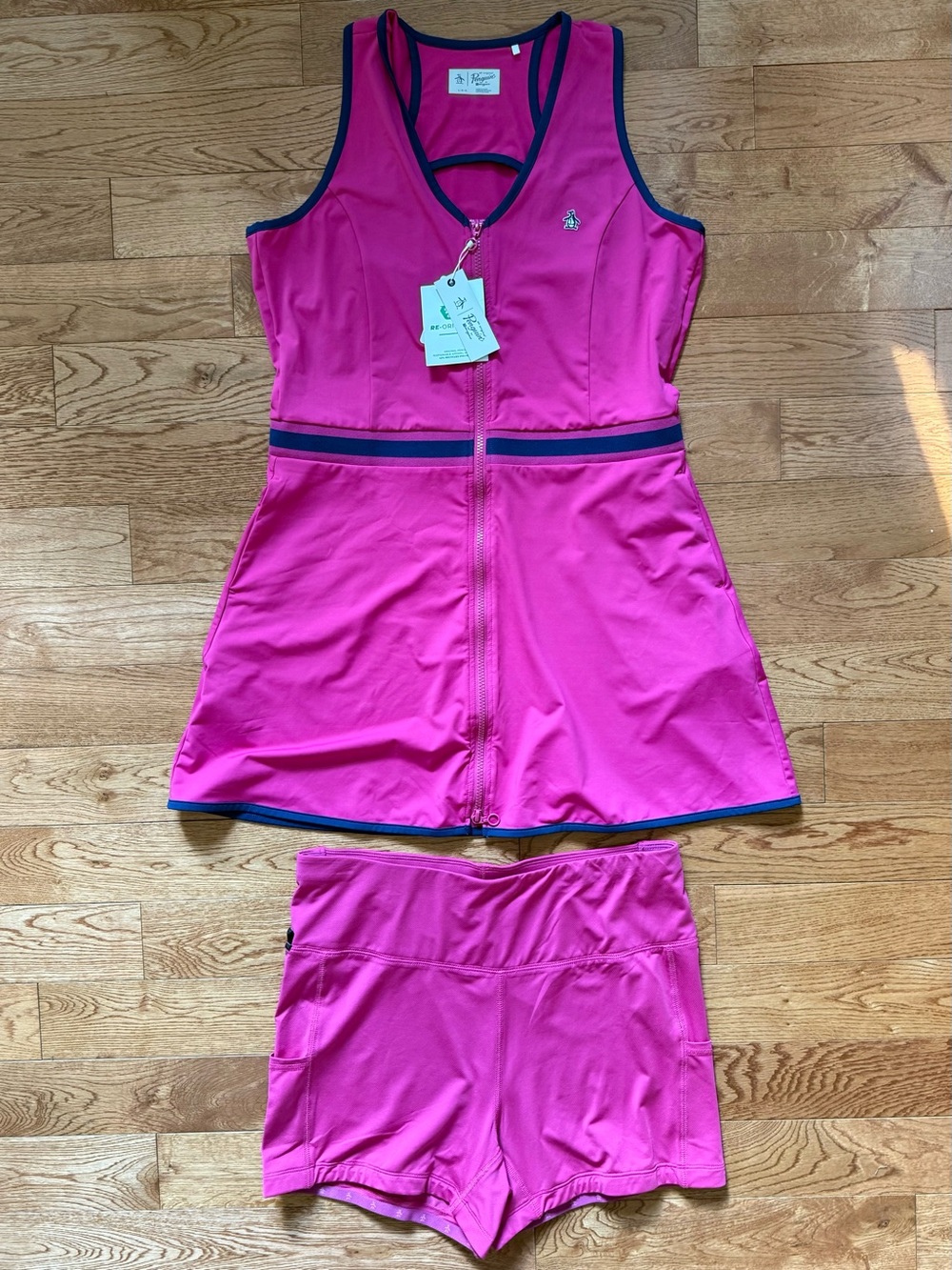Penguin NWT size L front-zip sleeveless golf dress and shorts.